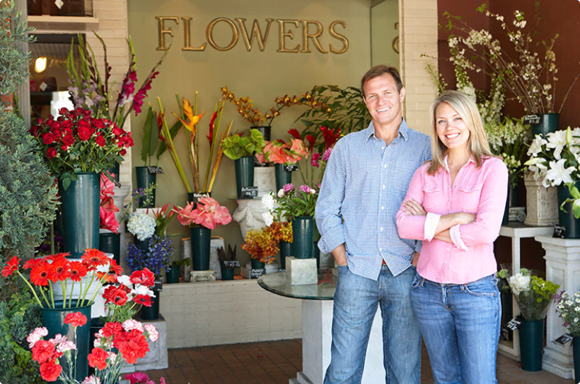 Owners inside their flower shop